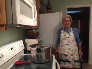 Woman in front of stove