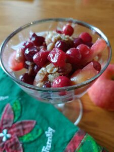cranberry apple crisp in a clear bowl 