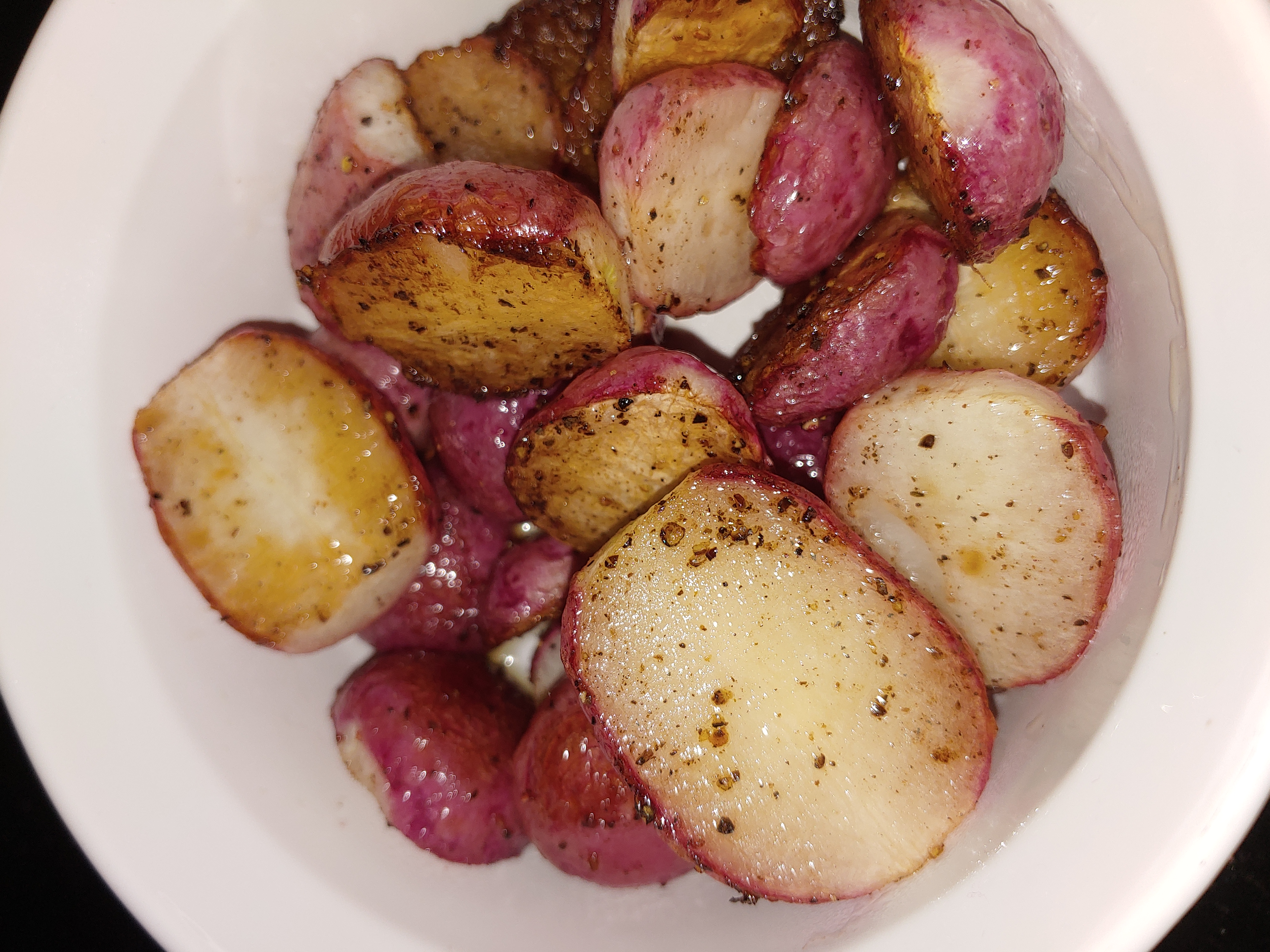 roasted radishes in a white bowl