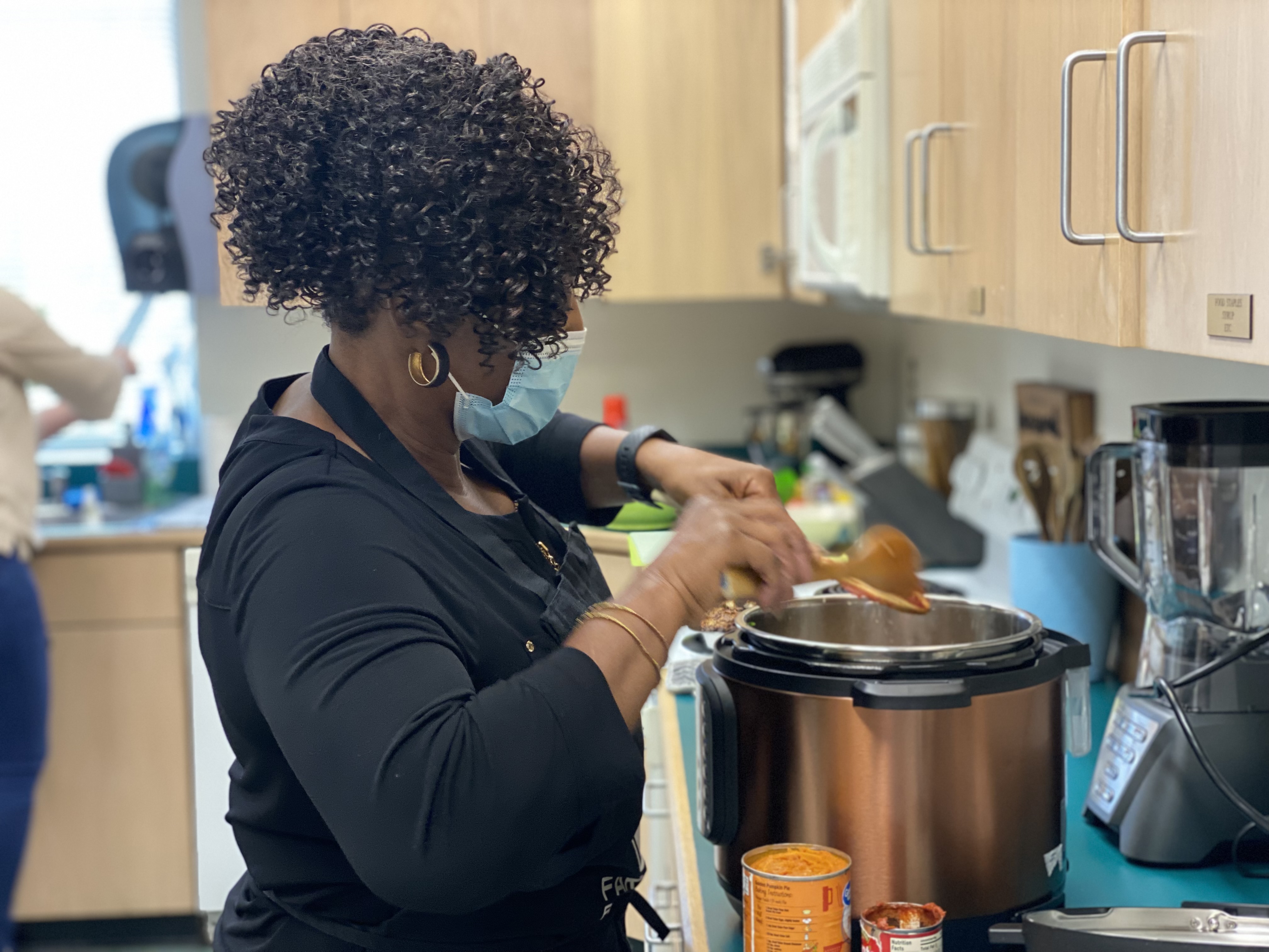 Extension Master Food Volunteer, Laura Vaughan from Leland, testing the Pumpkin Chicken Chili recipe in the electric pressure cooker.