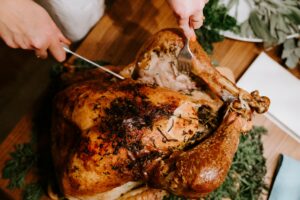knife being used to cut open turkey