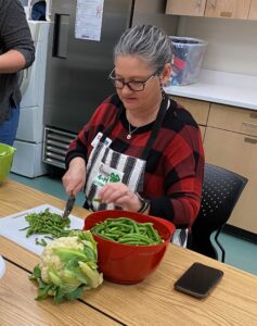 EFNEP educator chopping vegetables 