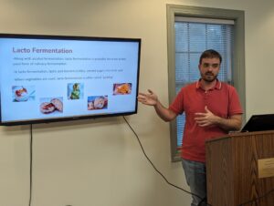 A man gives a presentation on Lacto Fermentation