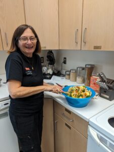 Extension Master Food Volunteer, Terry Amrhein from Sunset Beach sautés the vegetables