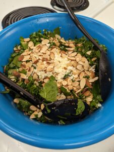 final product; kale arugula farro salad in a bowl
