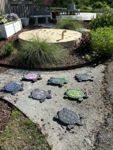 photo of stone turtles that the youth have painted