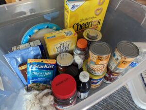 clear bin full of dry/canned food for hurricane preparedness
