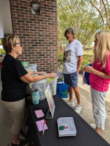 Extension Master Food Volunteer, Lori Van Horn from Ocean Isle Beach greets participants at the N.C. Cooperative Extension exhibit at the Brunswick County Health and Wellness Fair.