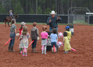 Rodeo entertainer Keith Isley led a stick pony race for the kids that was both adorable and hilarious.