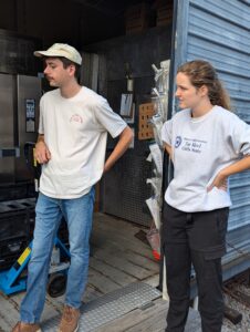 food hub manager and coordinator posing at Food Hub.