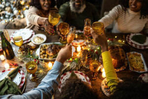 Family toasting on Christmas dinner at home