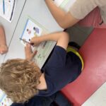 A child fills out a worksheet.