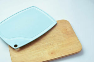 plastic and wooden cutting board