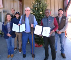 NCDA & NCSU License Agreement signing by NC Commissioner of Agriculture, Steve Troxler, and dean of the College of Natural Resources at NC State, Dr. Myron Floyd. From left to right pictured are, Upper Mountain Director, Teresa Lambert; director of NC State Christmas tree Genetics Program, Dr. Justin Whitehill; interim assistant vice chancellor of Technology Licensing at NC State, Brian Eller; Steve Troxler; Dr. Myron Floyd; and director of operations at UMRS, Tracy Taylor.