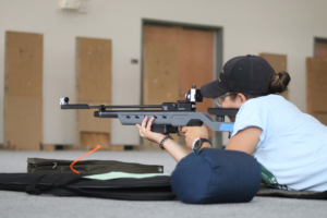 Rylee MacDonald shooting air rifle at regional competition